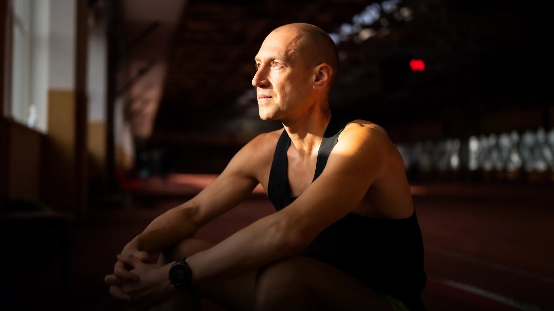Ultramarathon runner Aleksandr Sorokin resting trackside